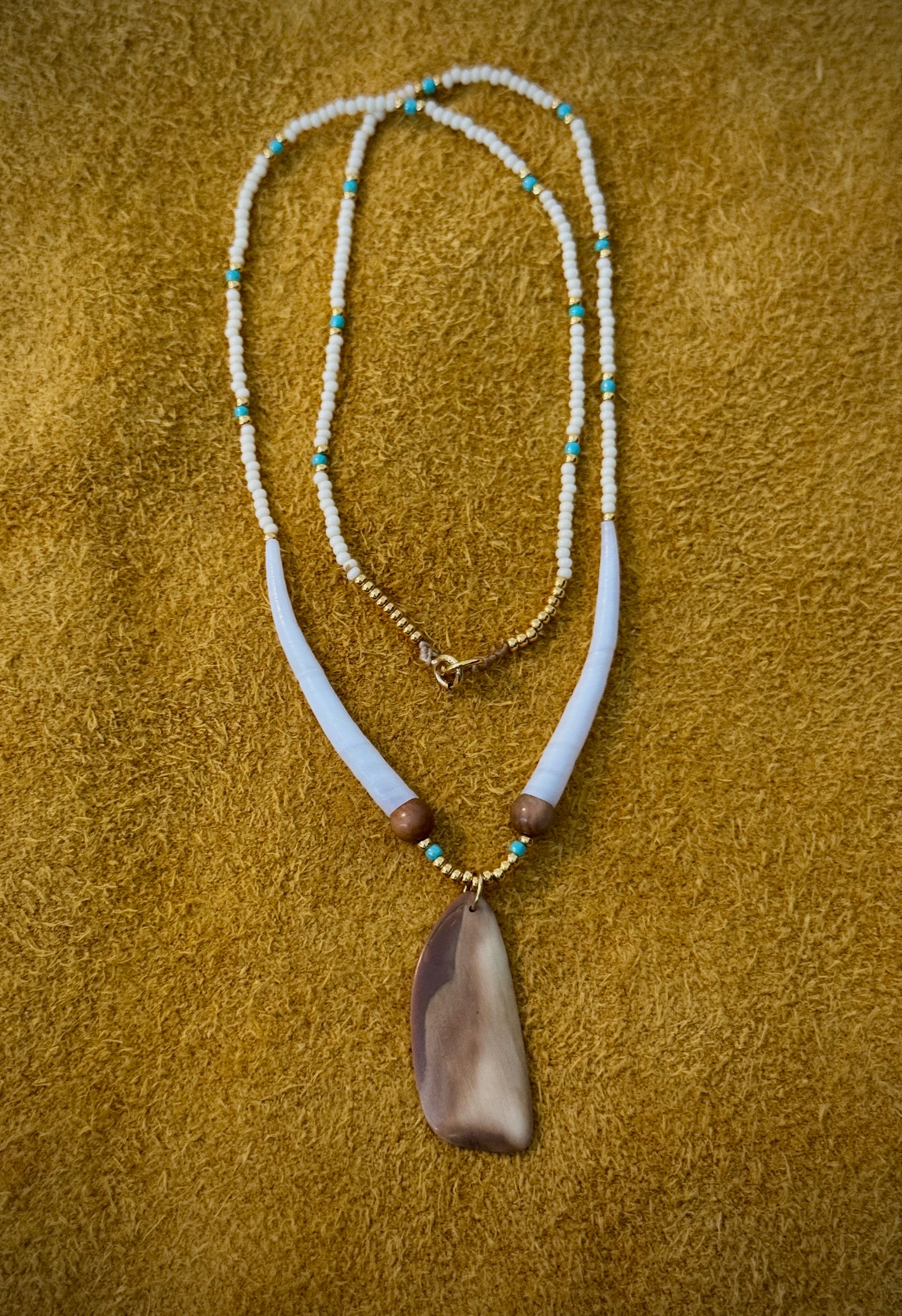 Fossilized walrus ivory pendant with mammoth ivory beads